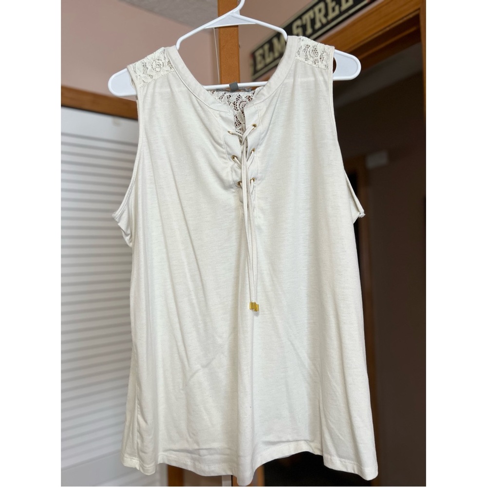 Daisy Fuentes: White/cream colored sleeveless top. Very soft